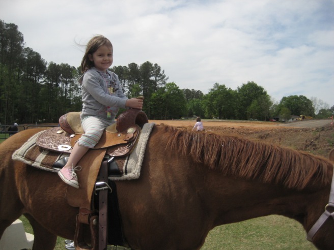 Can anything make a little girl smile like that except a horse?